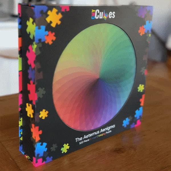 Animated view of The Aeternus Aenigma puzzle, translucent pieces overlapping and mixing colour